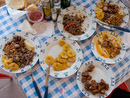 Cuban lunch spread: plaintains, roast pork, rice with black beans, "ropa vieja"