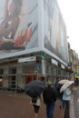 Huge posters attached to the H&M  store advertise their bikinis while the weather is decidedly not suited for the beach